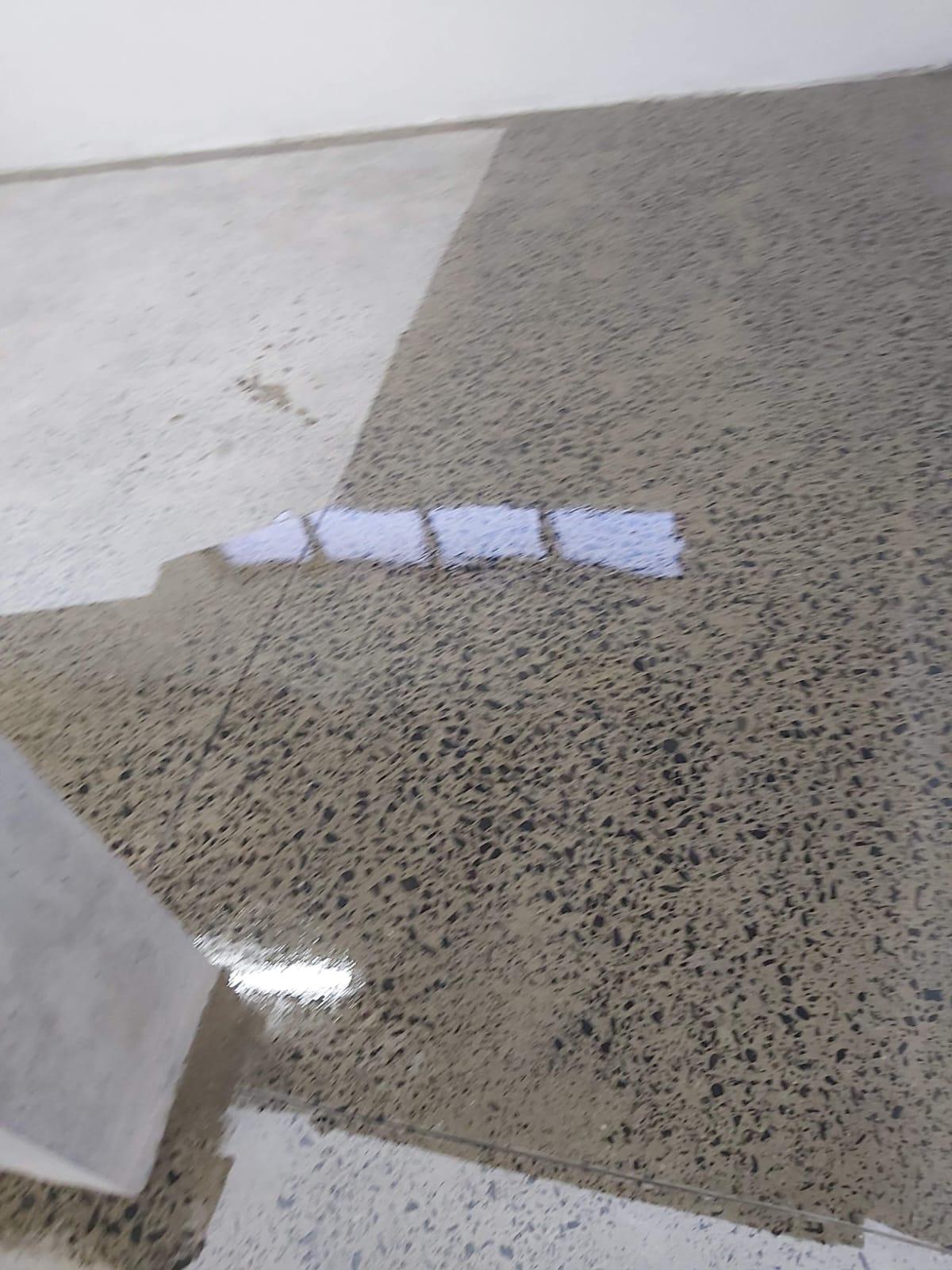 Polished concrete floor in a showroom with a smooth, reflective surface
