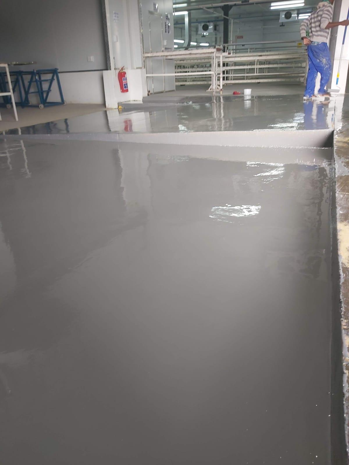 Completed epoxy coating across a warehouse