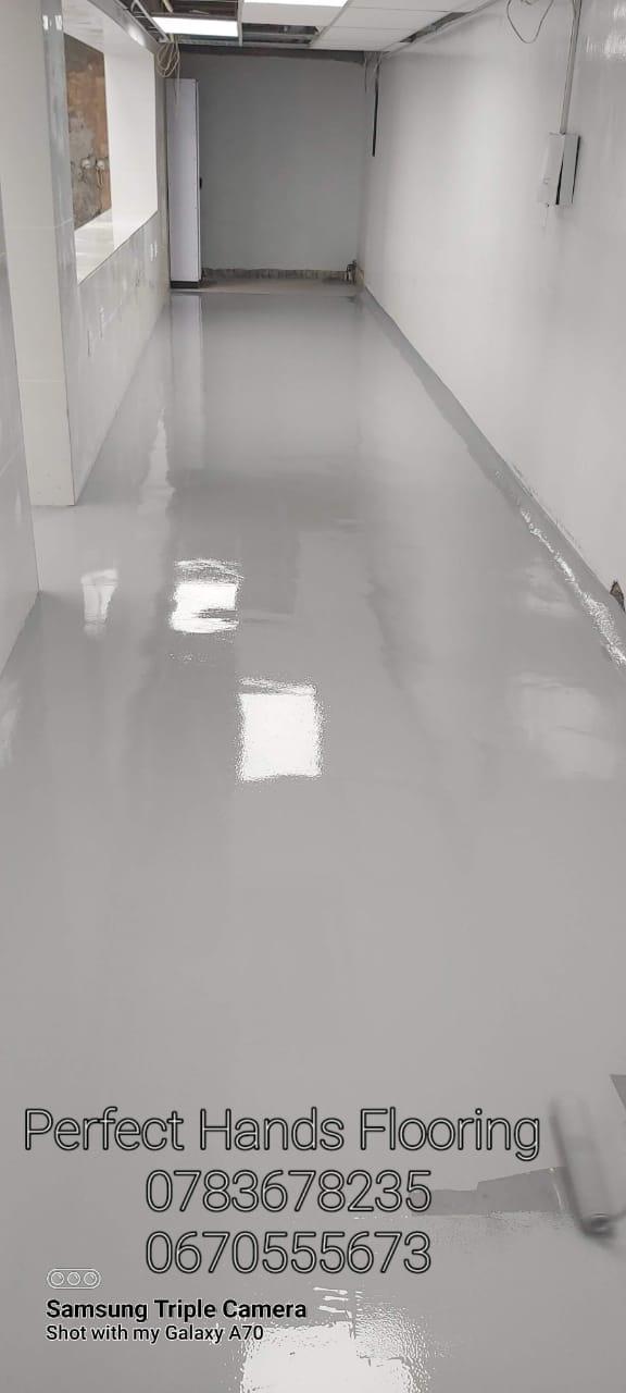 Polyurethane roller coat floor with a continuous, sealed surface